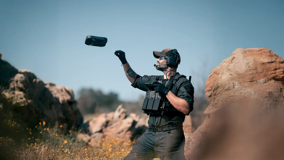 Operator hand-launching Darkhive YellowJacket—throw-and-go tactical drone for public safety missions