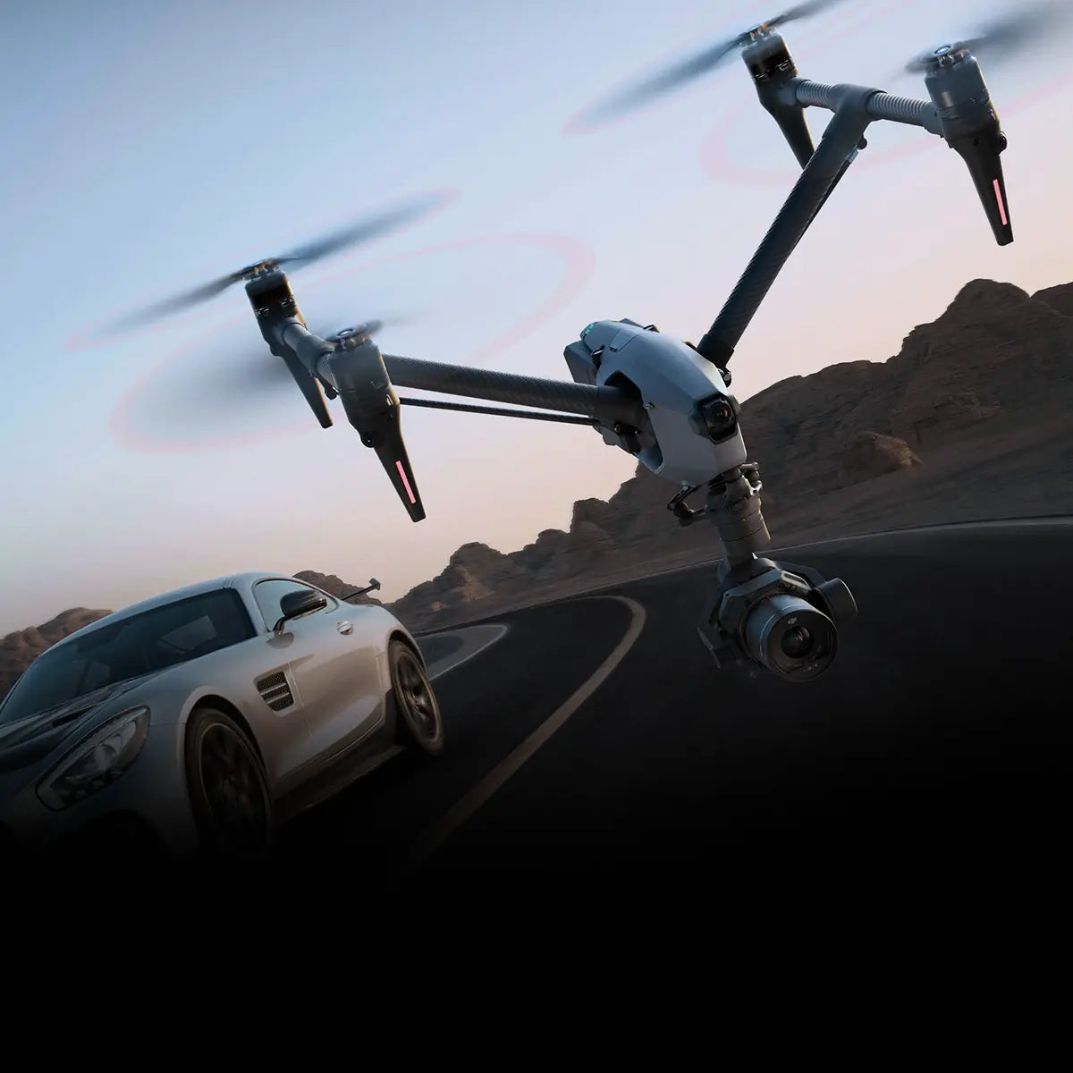 A DJI Inspire 3 being flown in an exterior movie set.